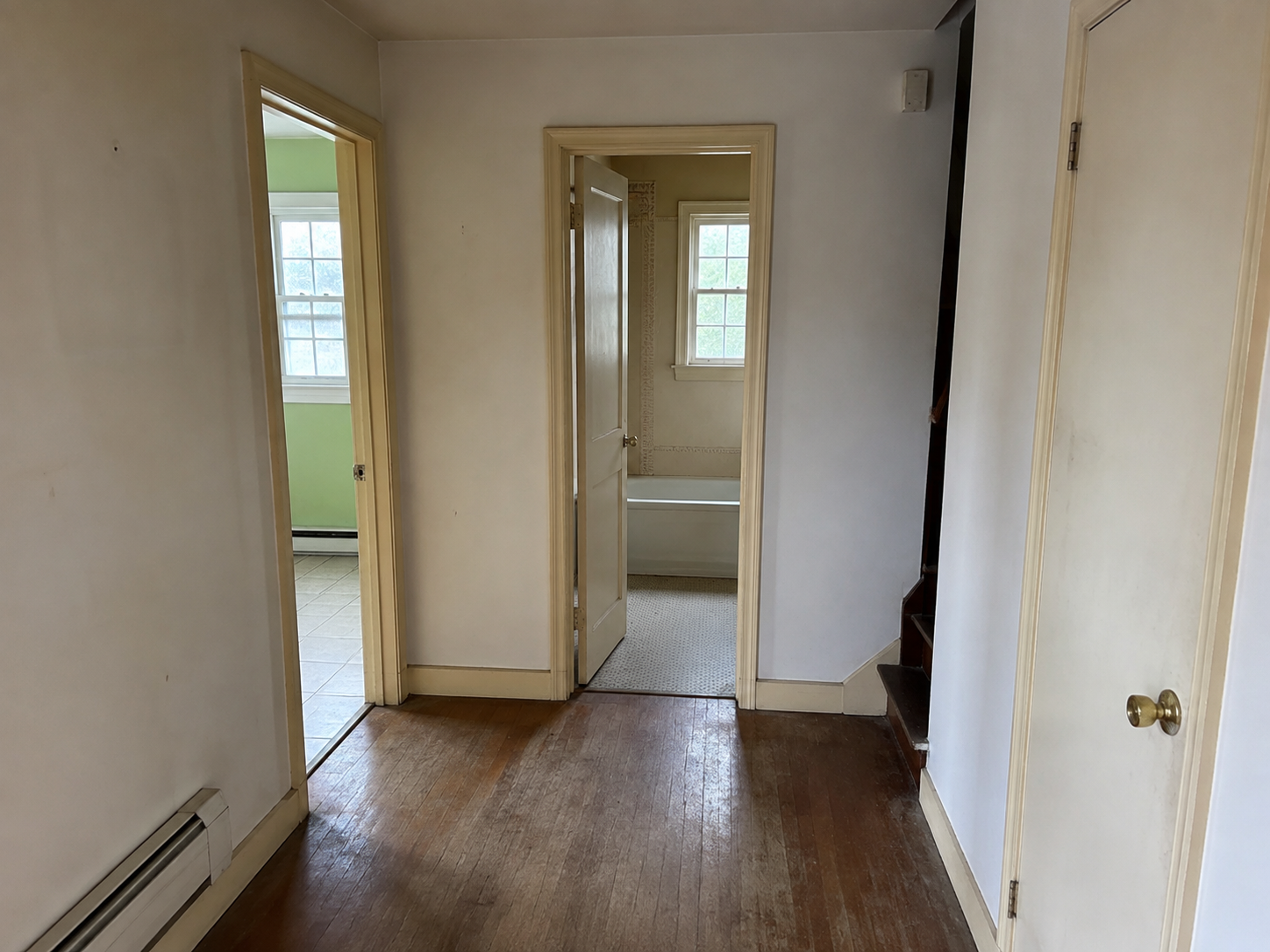 Illustrative image of dated interior trim and worn flooring before remodeling