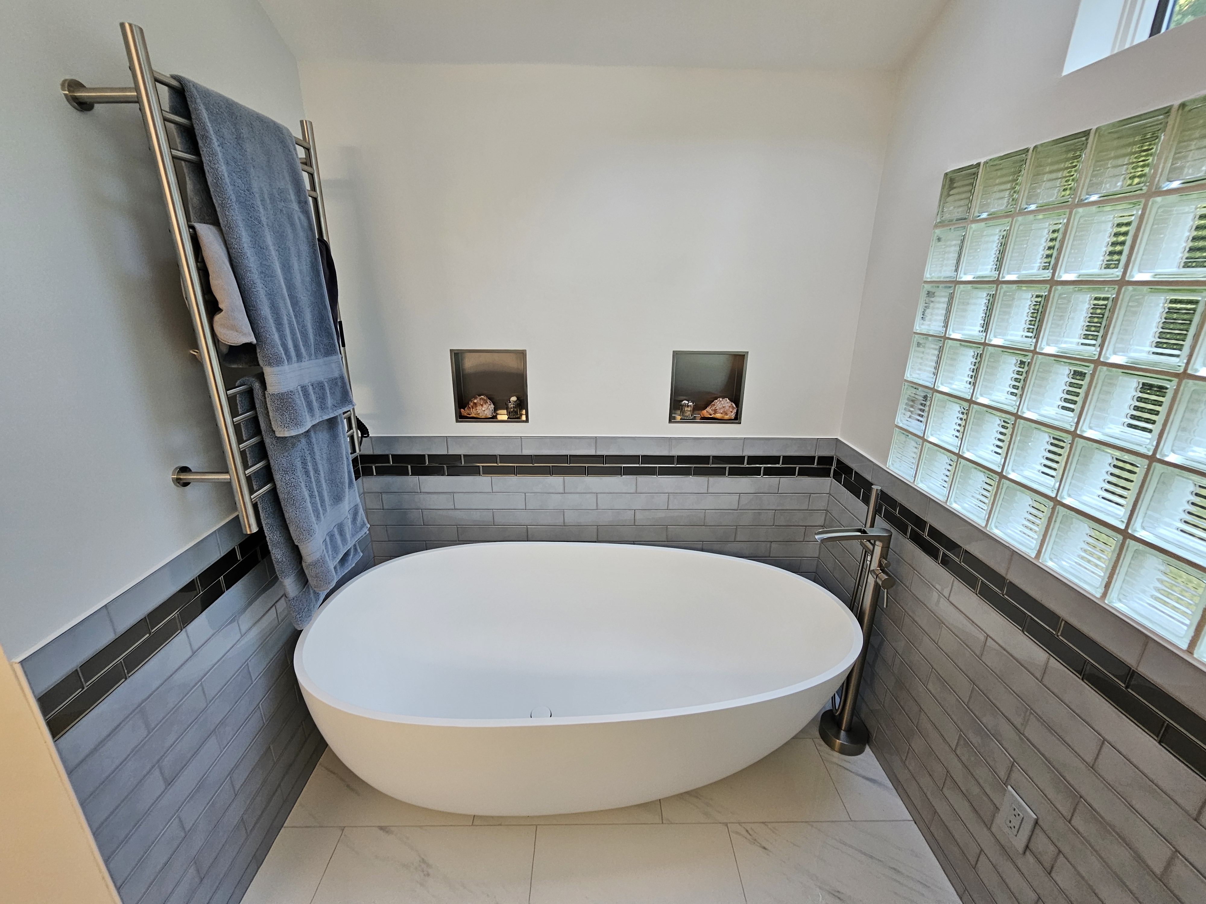 Finished bathroom tile and glass shower detail